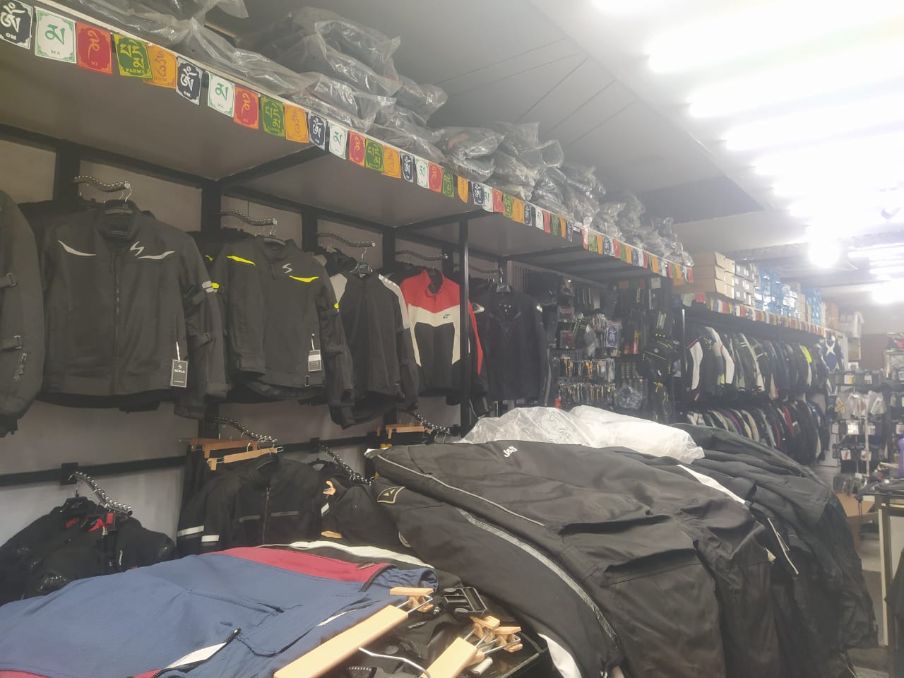 MotoGearX shop interior with premium motorcycle gear on display